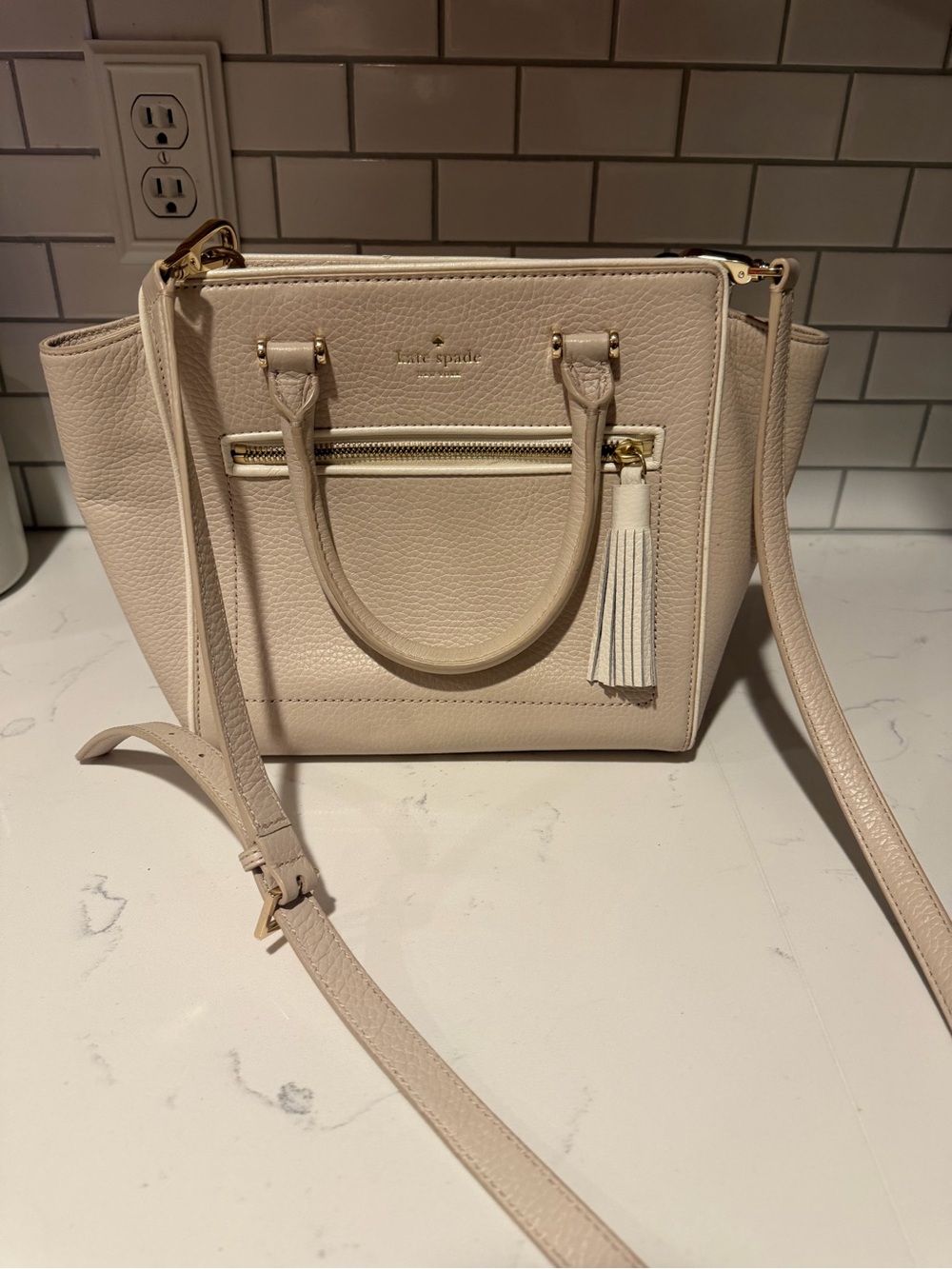 kate spade pebble leather satchel in light cream with tassel